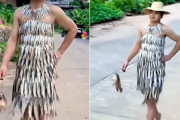 このあとおいしくいただいちゃうスタイルなのか？魚のドレスを身にまとった男性